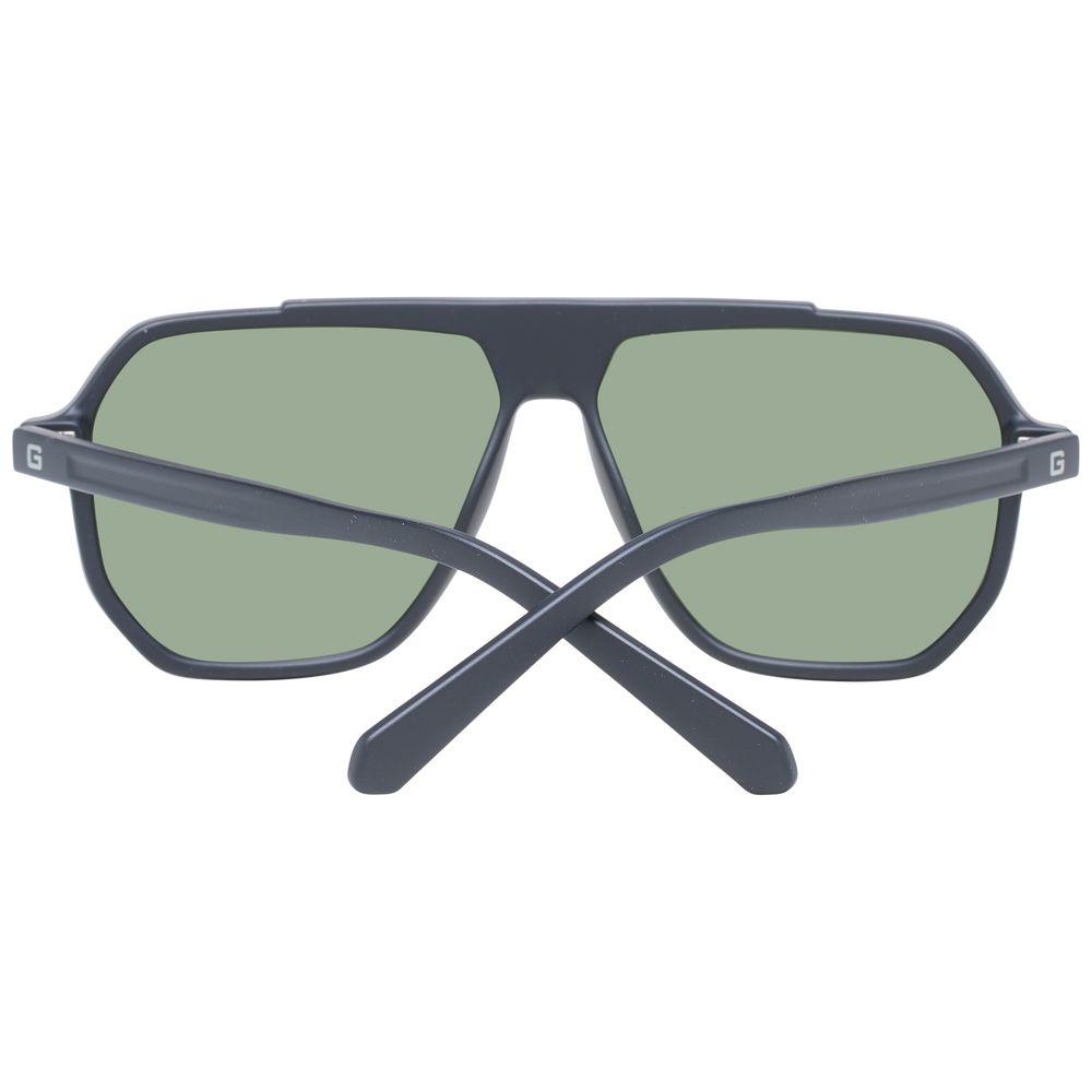 Guess black men sunglasses with green lenses, aviator style, full-rim plastic frame. Offers 100% UVA/UVB protection. Includes branded case.