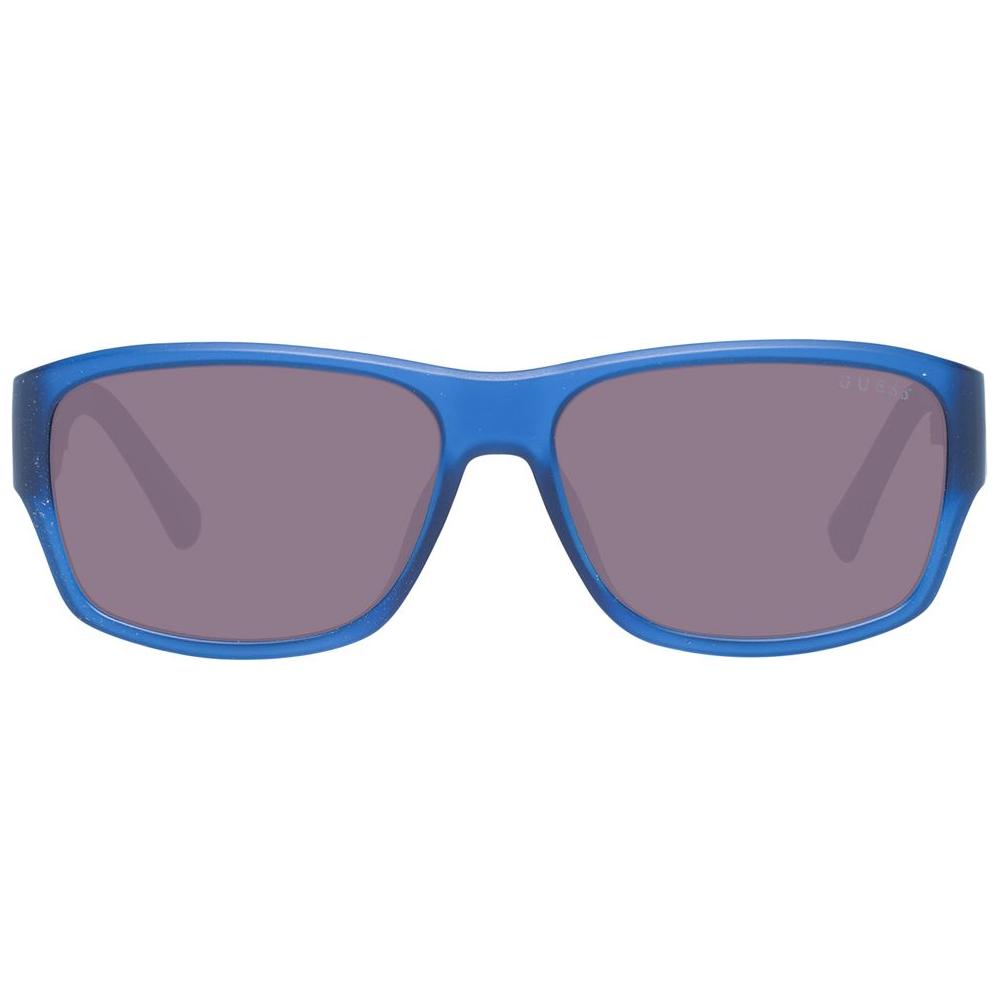Blue unisex Guess sunglasses with plastic frame and gradient brown lenses, 51mm wide, offering 100% UVA & UVB protection, trapezium style.