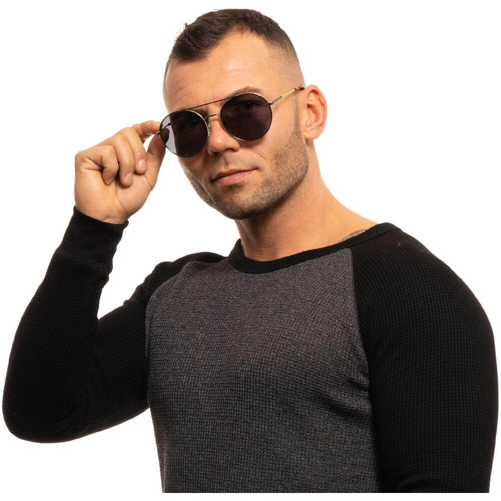 Man wearing Gant gray men's sunglasses with gunmetal metal frame and grey plastic lenses
