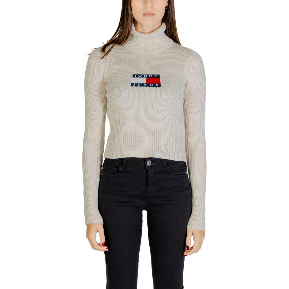 Model wearing Tommy Hilfiger Women's Beige Recycled Polyester Sweater from Fall/Winter collection, featuring ribbed design.