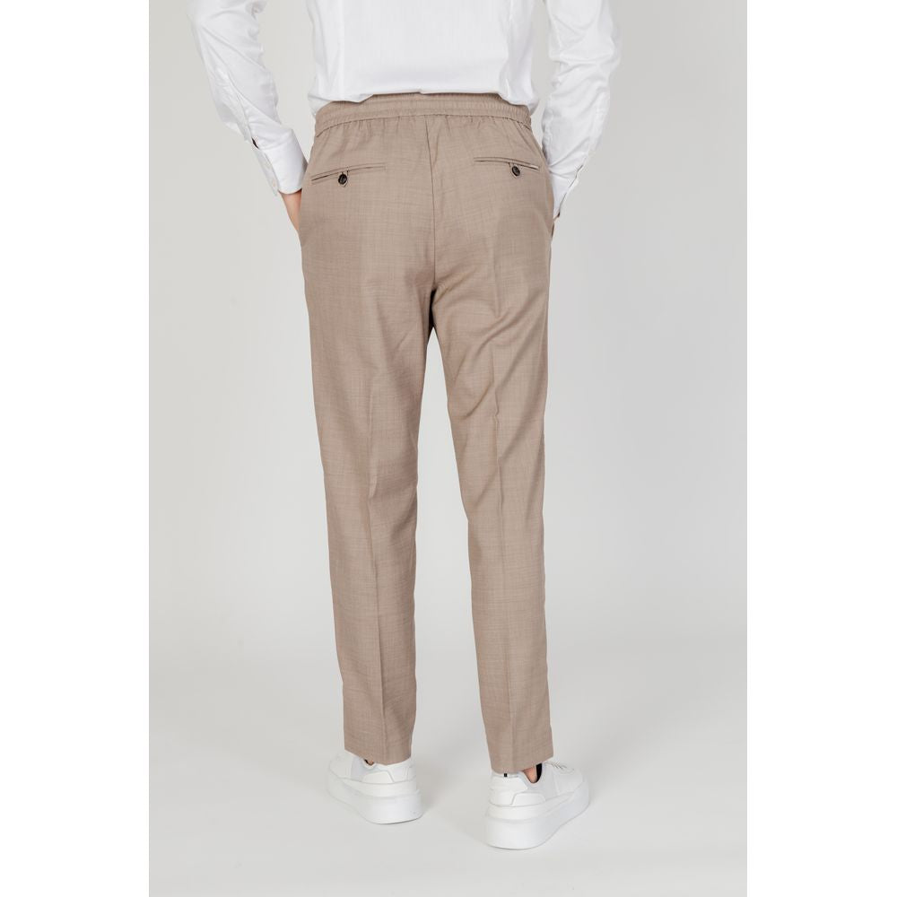 Rear view of Antony Morato beige polyester men's pants, spring/summer collection, featuring sleek design and modern fit.