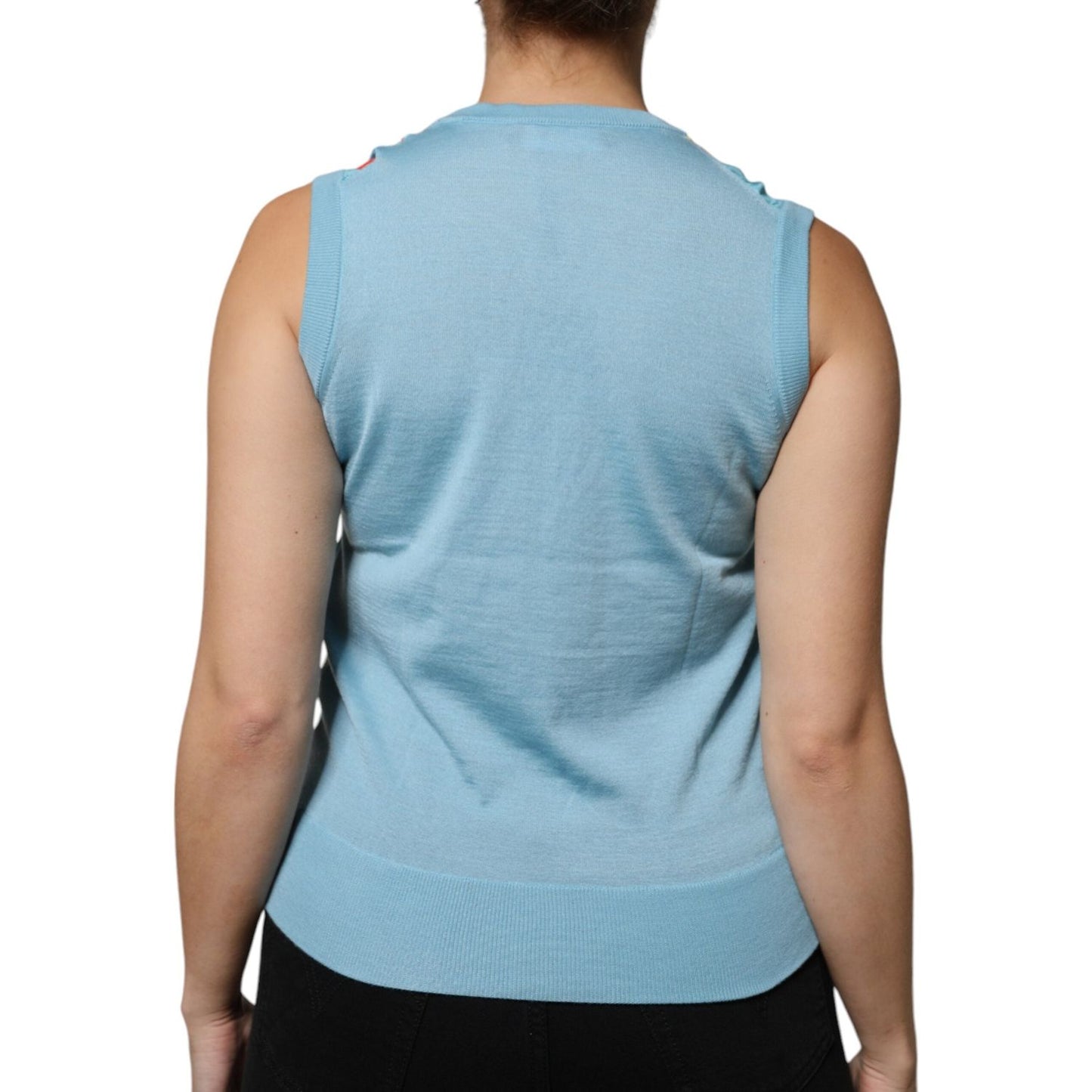 Back view of Dolce & Gabbana blue cashmere sleeveless tank top worn by model, showcasing simple design ideal for casual wear.