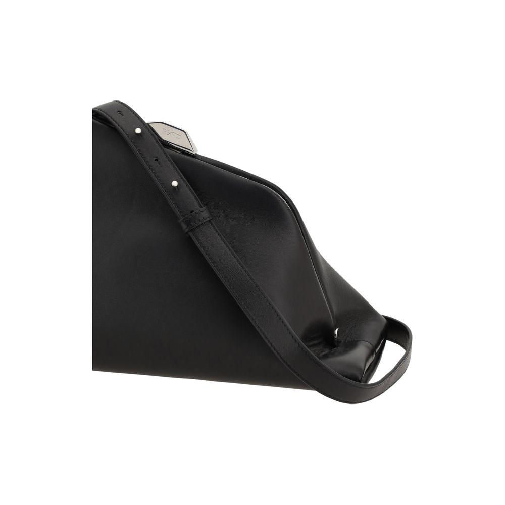 The Attico Day Off Shoulder Bag in black leather, featuring geometric shape, adjustable strap, top magnetic snap, and interior pocket.
