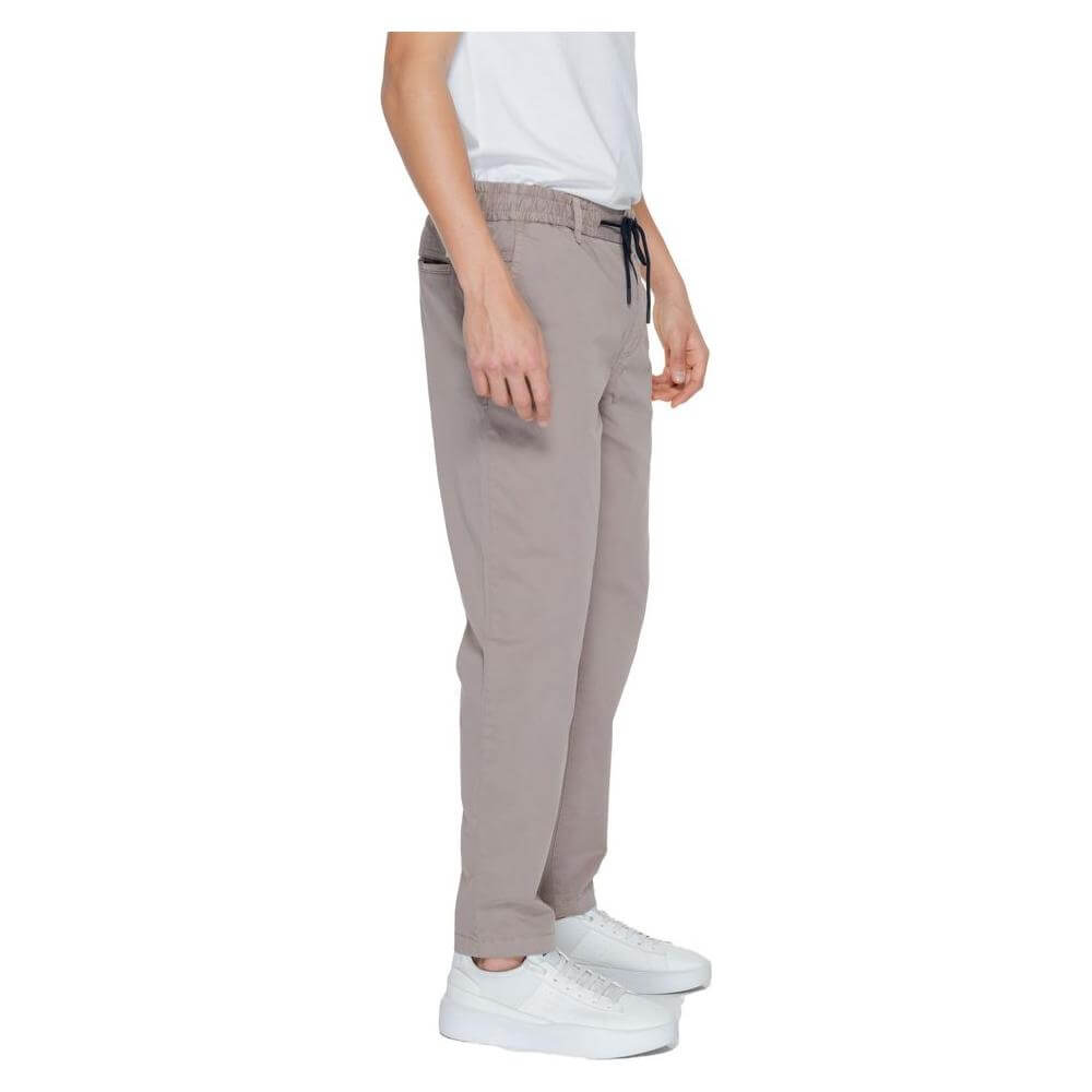 Side view of Hugo Boss brown men's tapered cotton jeans for spring/summer collection, featuring a blend of cotton and elastane.