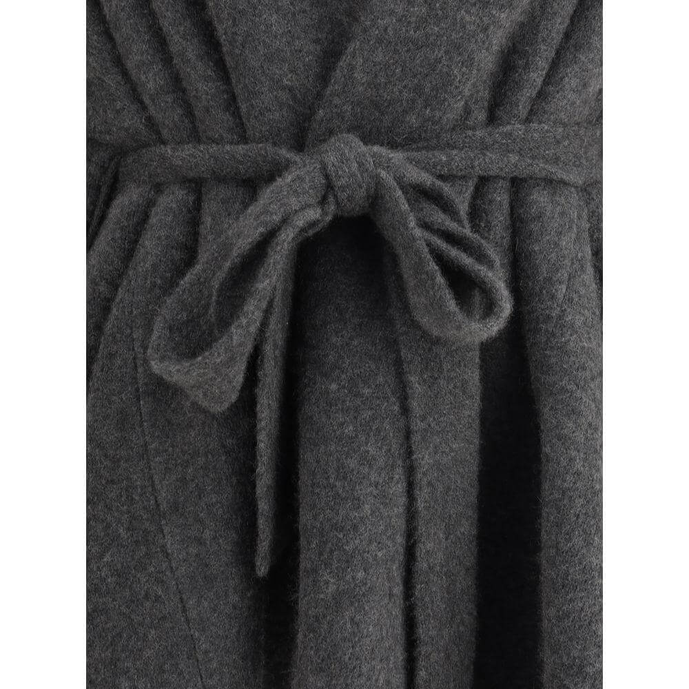 Close-up of The Row Ija Coat showcasing shawl lapels and knotted sash closure in dark fabric finish.