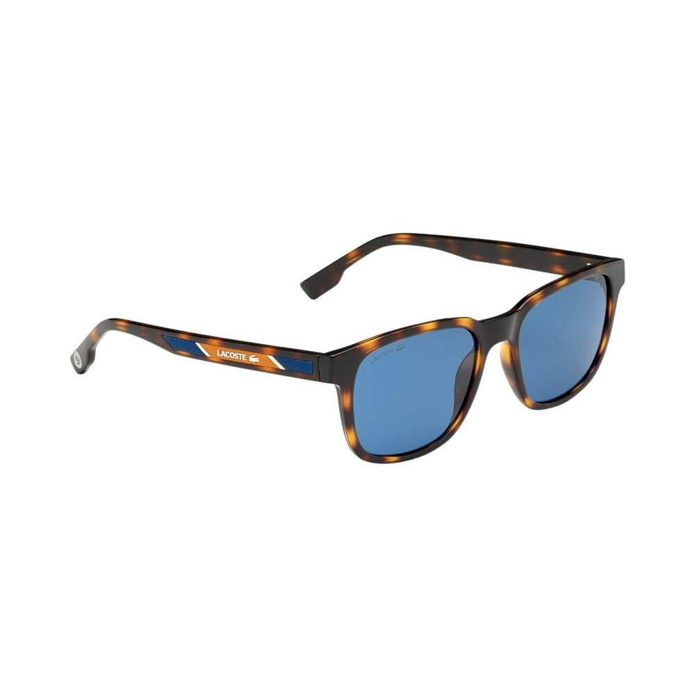 Lacoste brown injected sunglasses with blue lenses, model L980SRG-242, featuring a tortoiseshell pattern frame. Measures 54/18/145mm.