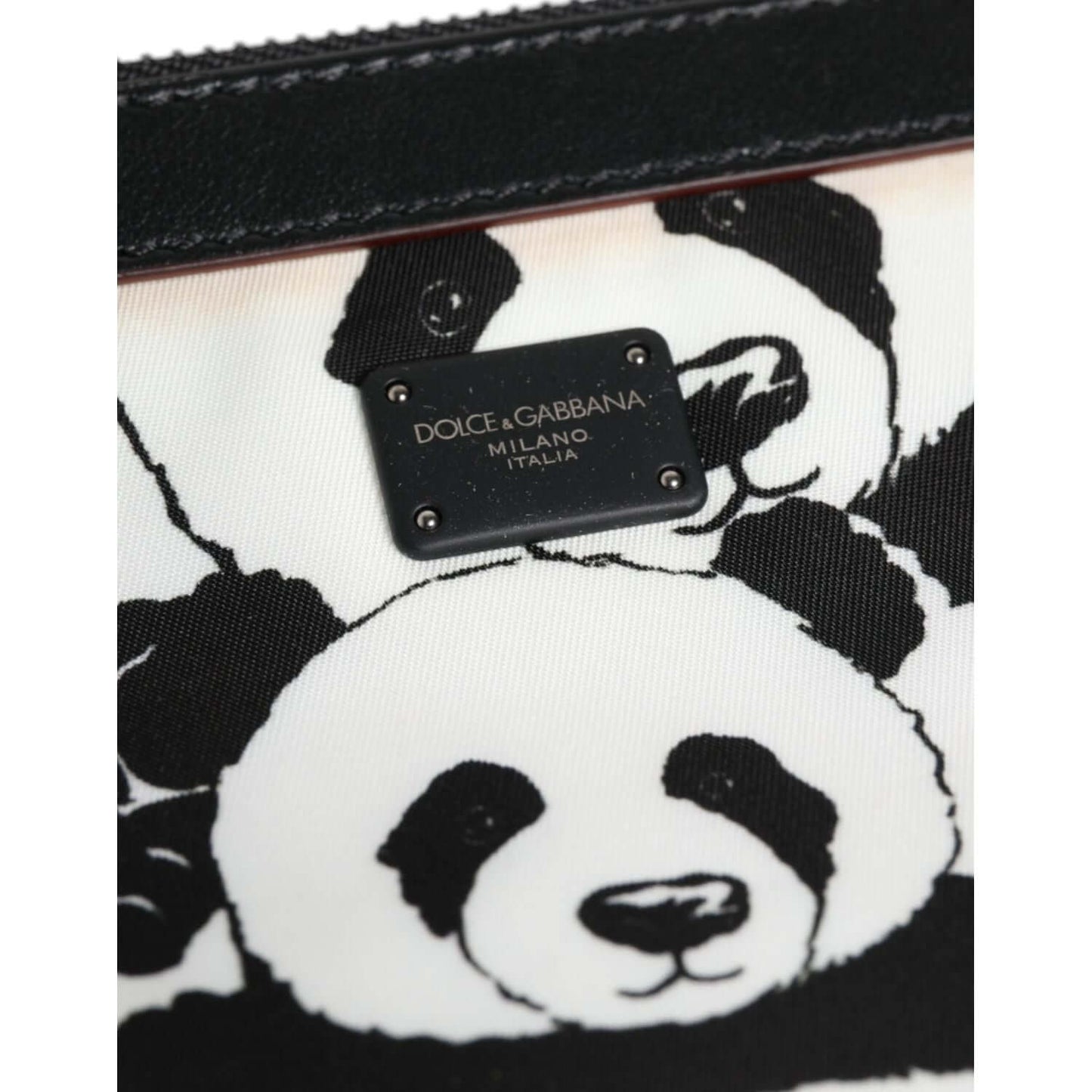 Dolce & Gabbana black and white panda pattern clutch with logo plate and gunmetal-tone hardware.