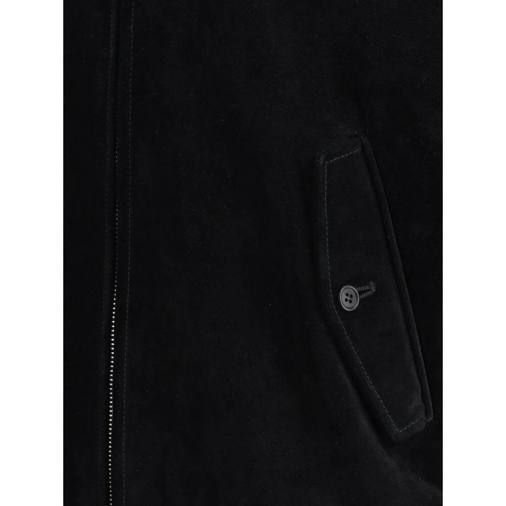 Close-up of Prada suede bomber jacket with zipper and buttoned pocket detail, showcasing its sleek design and quality craftsmanship.