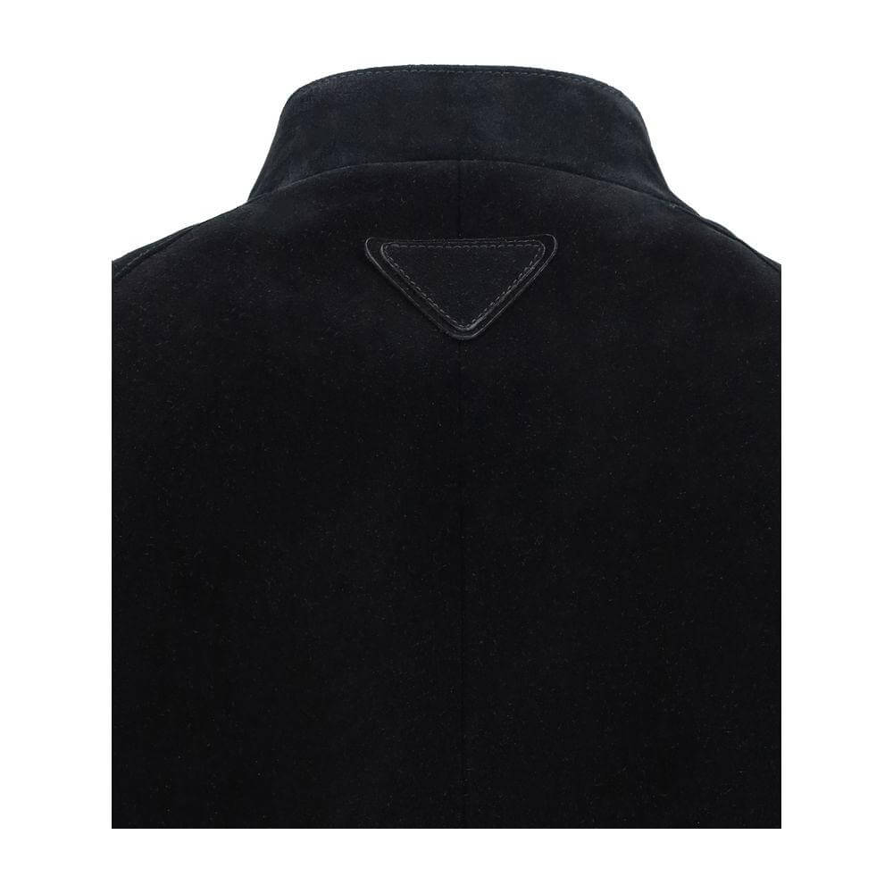 Back view of Prada Bomber Jacket showing suede finish and triangular brand patch, highlighting the sophisticated design and high collar.