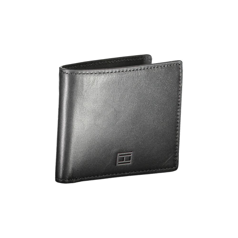 Tommy Hilfiger black leather men's wallet with embossed logo, featuring double compartments for organized card storage.