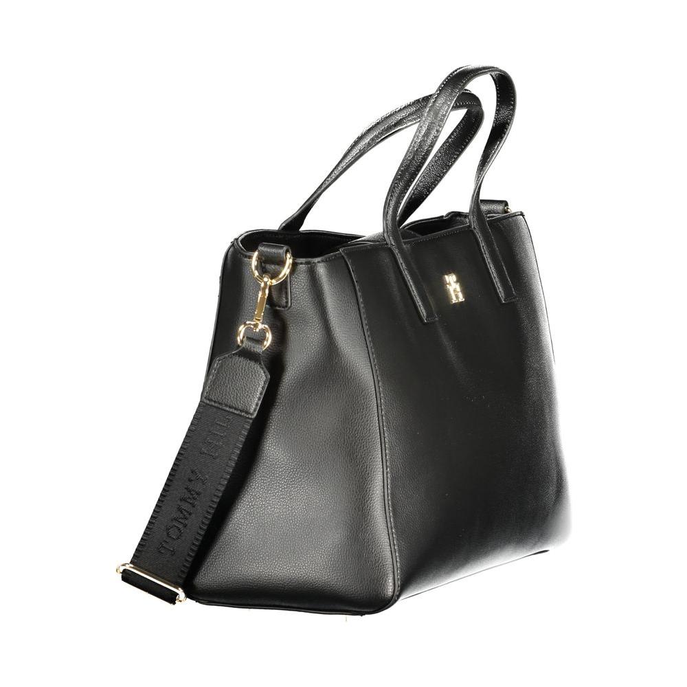 Tommy Hilfiger black polyester women's handbag with detachable shoulder strap and dual handles, eco-friendly and spacious design.