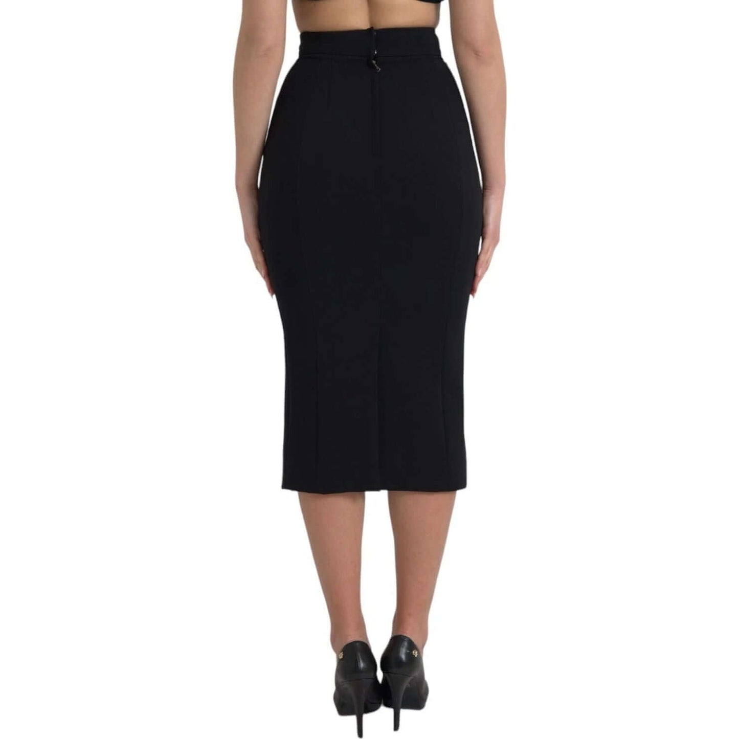Back view of Dolce & Gabbana Black Wool High Waist Pencil Midi Skirt with back zipper closure, worn by a model, showcasing the elegant design.