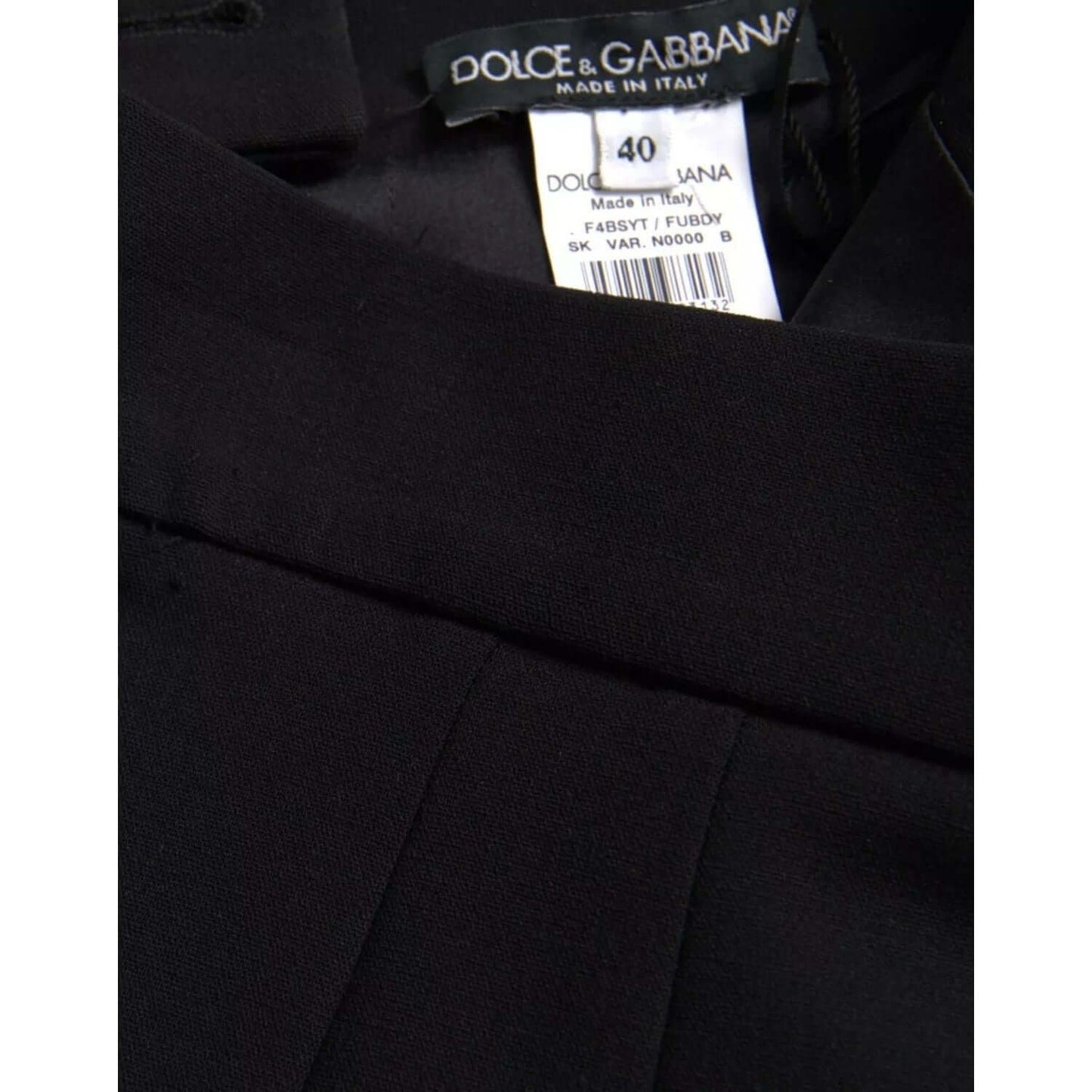 Dolce & Gabbana black wool high waist pencil cut skirt with label, featuring minor thread defect, made in Italy, size 40.