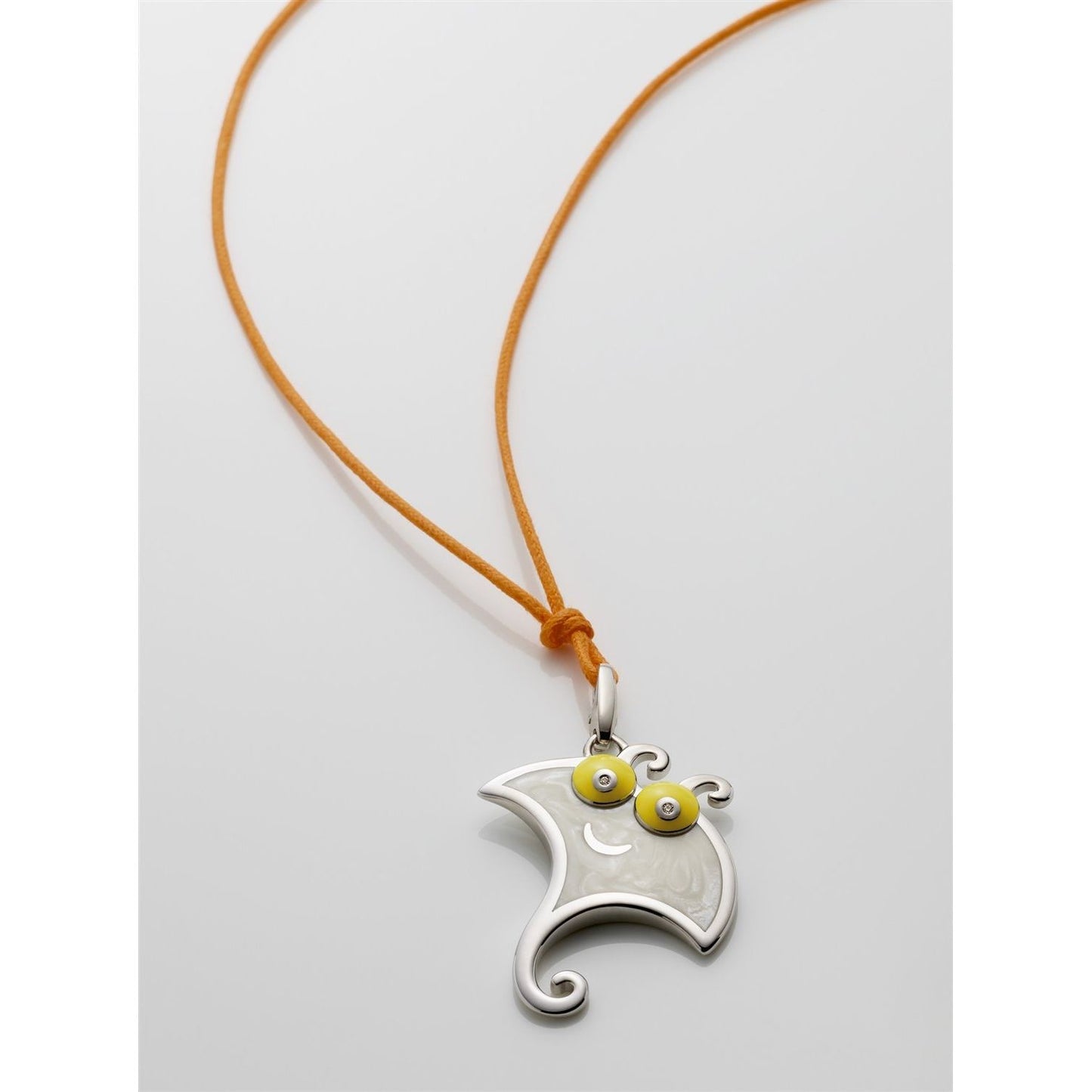 CHARMS CHANTECLER MOD. 35588 pendant on a brown cord necklace with intricate design.