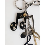 Dolce & Gabbana Silver Musical Note Key Holder Keychain Bag Charm Keyring with shiny finish and logo engraving.