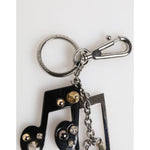 Dolce & Gabbana Silver Musical Note Key Holder Keychain Bag Charm Keyring with shiny silver finish and logo engraving.