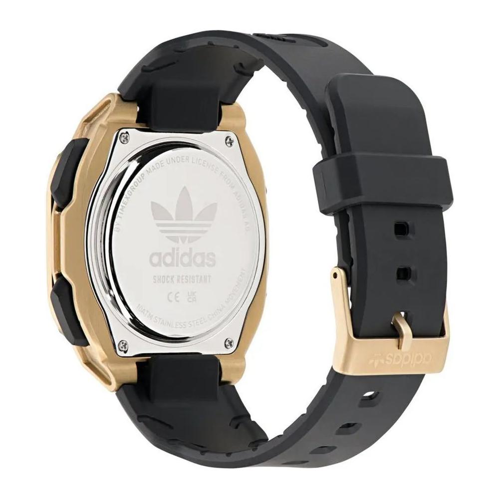 Adidas black synthetic watch with golden stainless steel case and black silicone strap, featuring analog/digital quartz display.