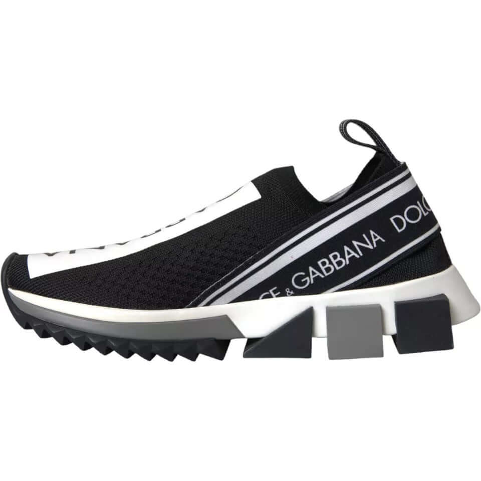 Dolce & Gabbana Sorrento slip-on sneakers in black and white with logo print and rubber sole, featuring a pull strap. Made in Italy.