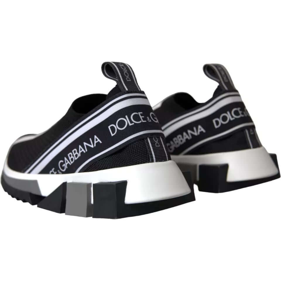 Dolce & Gabbana Sorrento sneakers in black and white with logo print and rubber sole, rear view showing fabric pull strap.