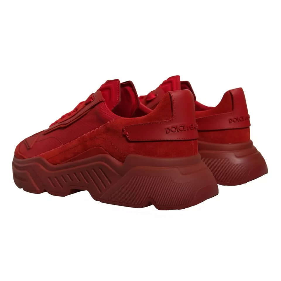 Dolce & Gabbana red leather Daymaster low top sneakers with rubber sole and logo detail, mismatched sizes 44 and 45, rear view.