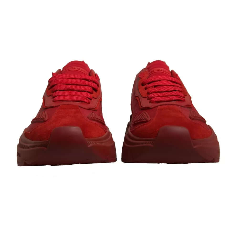 Dolce & Gabbana red leather Daymaster low top sneakers with rubber sole and logo details, front view. Mismatched sizes 44 and 45.