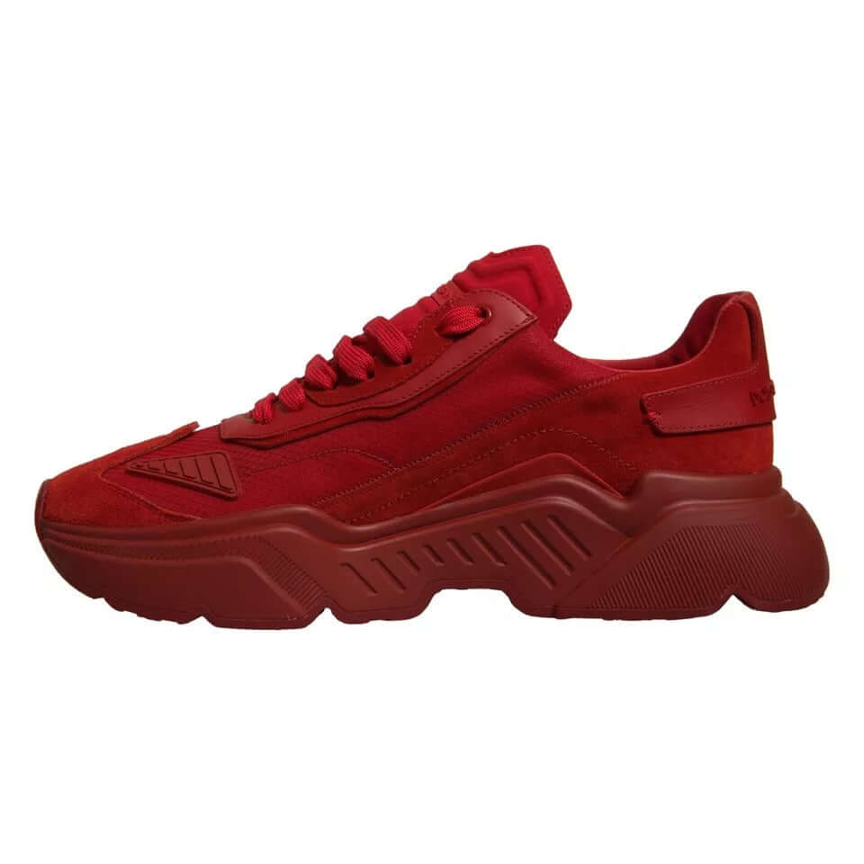 Dolce & Gabbana red leather Daymaster low top sneaker with rubber sole and logo details, mismatched sizes, side view.