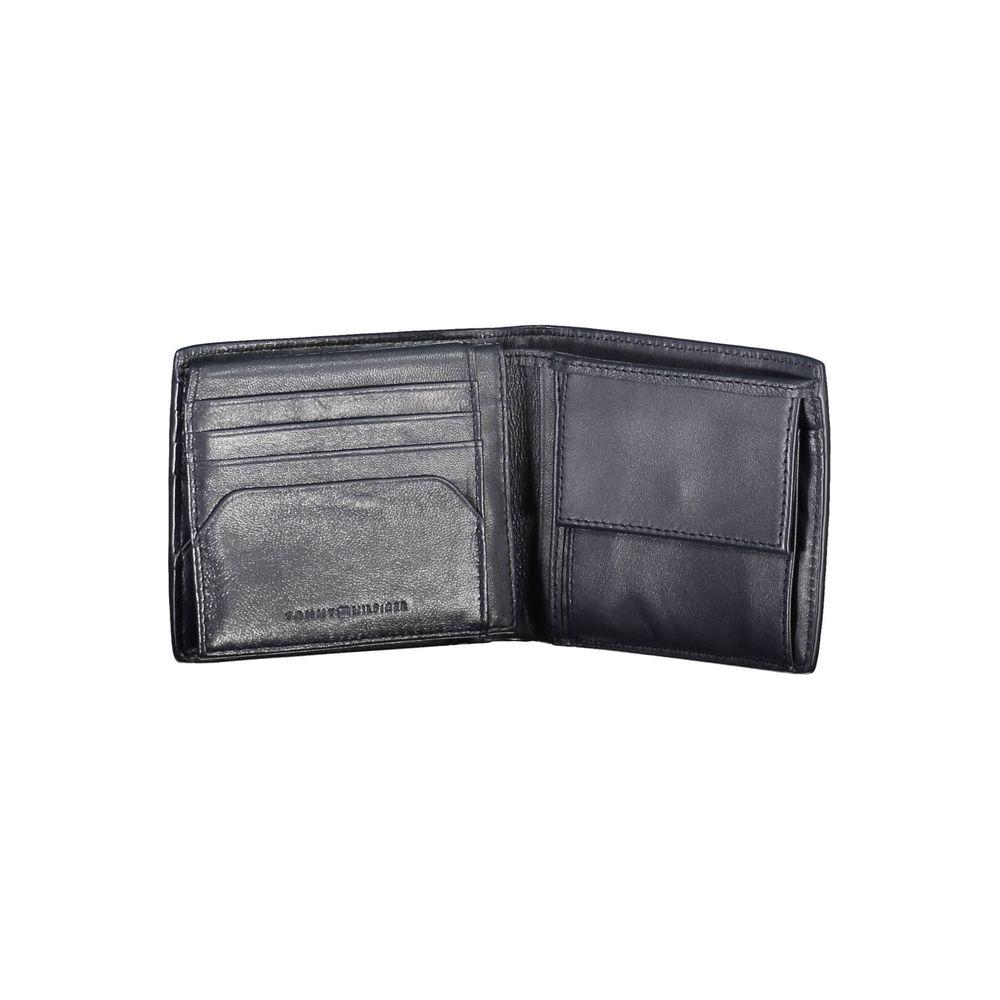 Tommy Hilfiger blue leather men's wallet with card slots and coin purse, featuring iconic logo. Sophisticated and functional design.