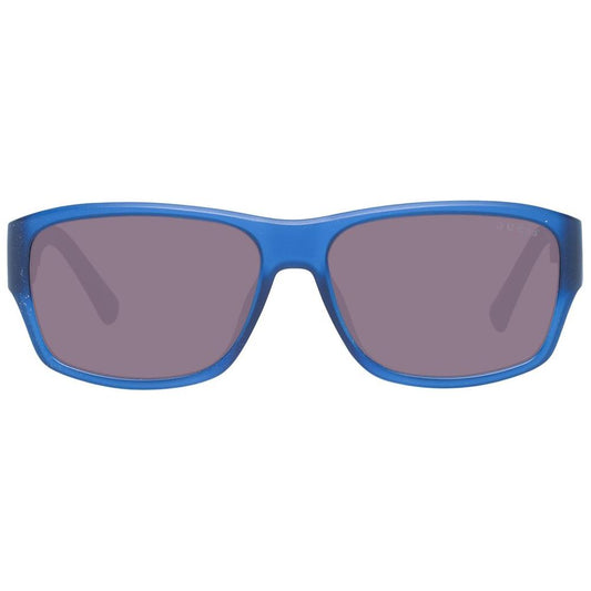 Blue unisex Guess sunglasses with plastic frame and gradient brown lenses, 51mm wide, offering 100% UVA & UVB protection, trapezium style.