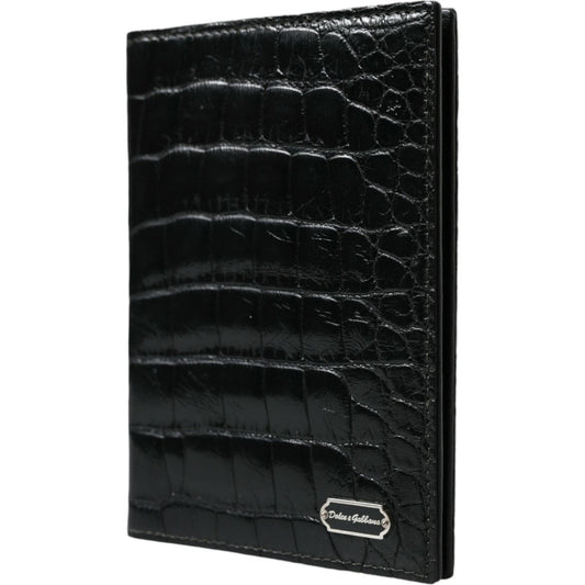 Dolce & Gabbana black crocodile leather bifold passport holder with logo plaque, made in Italy. Luxurious travel accessory.