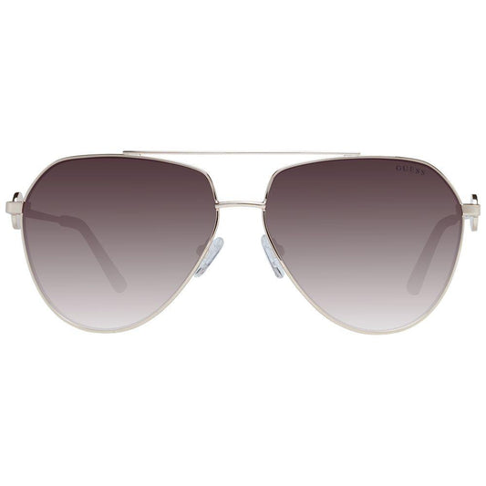 Guess gold aviator women's sunglasses with brown gradient lenses and full-rim metal frame. Offers 100% UVA & UVB protection.
