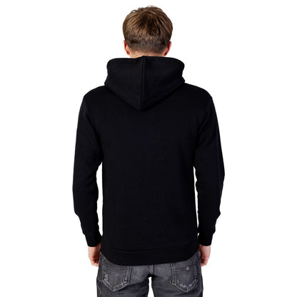 Back view of Jack Jones Black Polyester Hoodie worn by a man, showcasing its design and comfort.