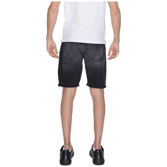 Back view of a man wearing Antony Morato black cotton Bermuda shorts, part of the men's spring/summer collection.