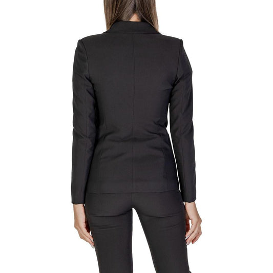 Back view of a woman wearing a Sandro Ferrone black polyester blazer, part of the Fall/Winter collection.