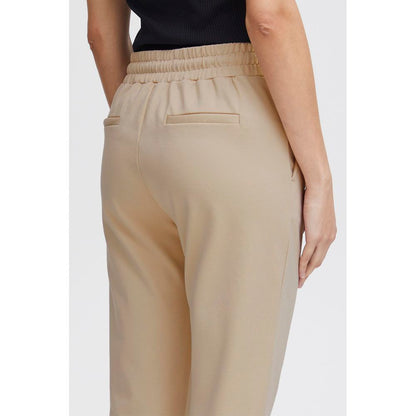 Back view of ICHI Beige Polyester Pants with mid-rise waistband and slim fit design.