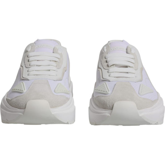 Dolce & Gabbana white leather Daymaster low top sneakers with rubber sole and lace-up closure, showcasing logo details, front view.