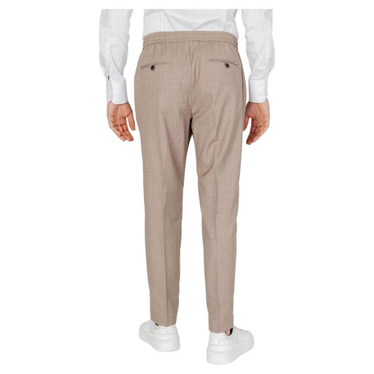 Rear view of Antony Morato beige polyester men's pants, part of the Spring/Summer collection, featuring elastic waistband and button pockets.