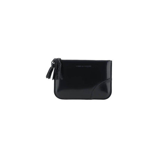 Comme Des Garçons leather coin purse with brand logo, shiny finish, and zipper closure. Perfect stylish accessory.