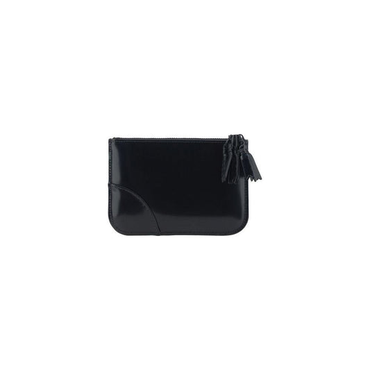 Comme des Garçons black leather coin purse with top zipper closure and signature logo, shiny finish.