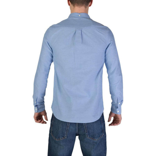 Back view of man wearing Lyle & Scott blue long sleeve organic cotton shirt, part of fall/winter collection.