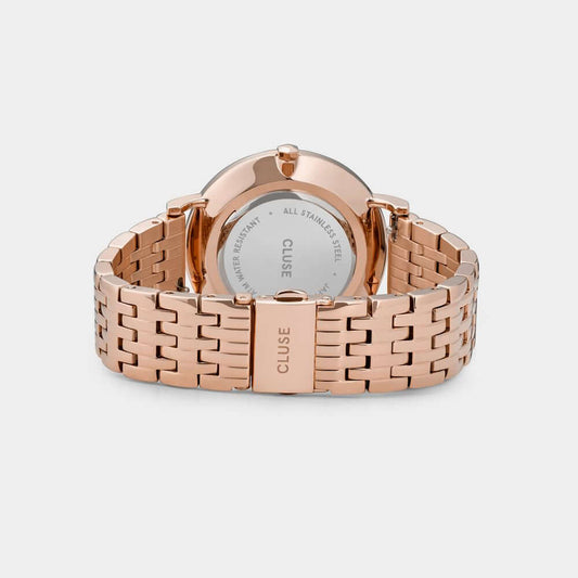 Back view of Cluse multicolor stainless steel watch with pink bracelet and case, showcasing quartz mechanism and pressure closure.