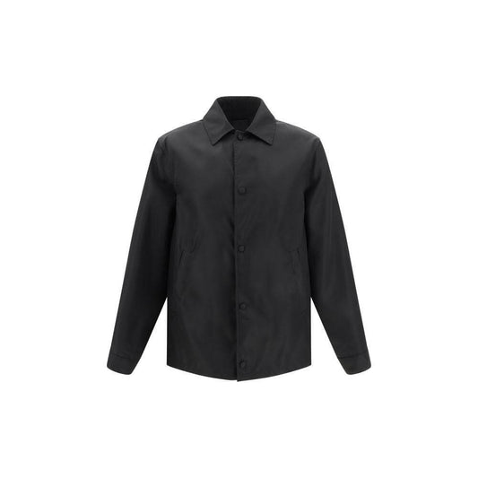 Givenchy oversized shirt with classic collar and snap-button closure, featuring adjustable cuffs, side welt pockets, and monogram embroidery.