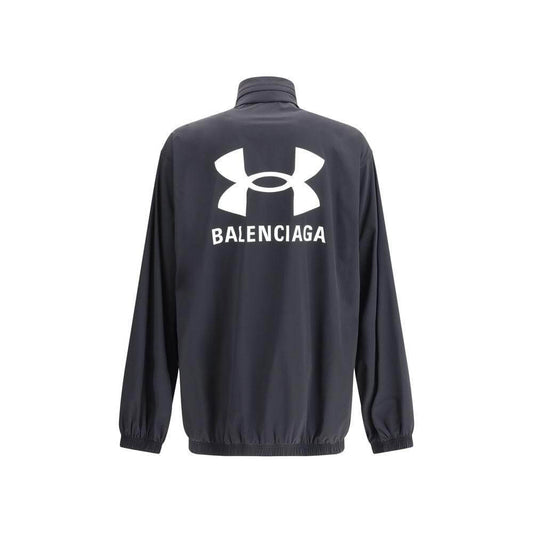 Alt Tag: Balenciaga jacket with front zipper, built-in hood, elasticized hem and sleeves, oversized fit, iconic brand monogram on back.