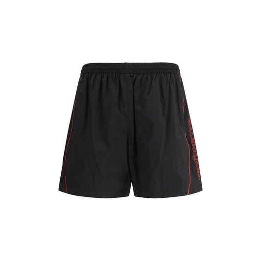 Balenciaga tracksuit shorts with elastic waistband and monogram stitch, featuring side welt pockets. Stylish and comfortable black shorts.