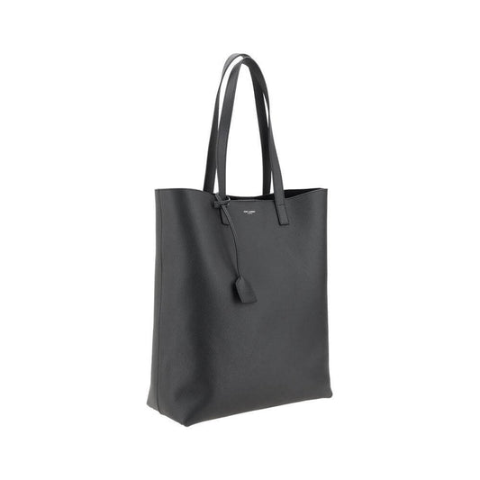 Saint Laurent black leather tote bag with grained texture, top handles, and monogram detail.