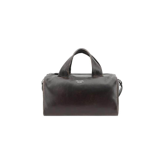 Prada leather men's travel bag with top zip closure, adjustable shoulder strap, and iconic monogram for luxury and versatility.