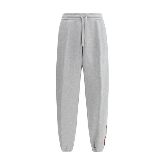 Gucci cotton sweatpants with colored side bands, featuring iconic monogram on back pocket, elasticated waistband, and mélange pattern.