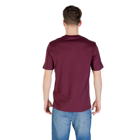 Back view of model wearing Lyle & Scott Bordeaux cotton T-shirt, showcasing casual style with short sleeves and classic fit.