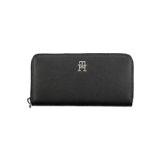 Tommy Hilfiger sleek black wallet with logo, featuring zip closure, card slots, and coin purse, ideal for organizing essentials.