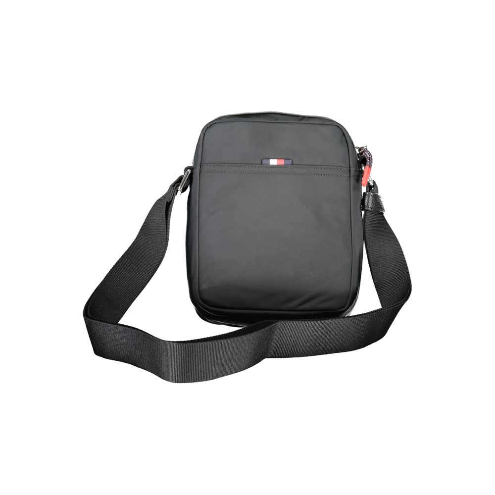 Tommy Hilfiger Black Polyester Shoulder Bag with adjustable strap, zip closure, logo, and recycled polyester material.
