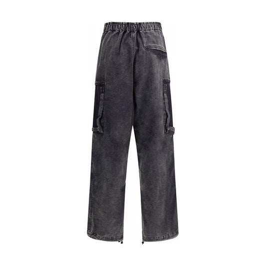 Maison Mihara Yasuhiro baggy cotton pants with adjustable drawstring waistband, front zipper closure, welt pockets, and side monogram patch.